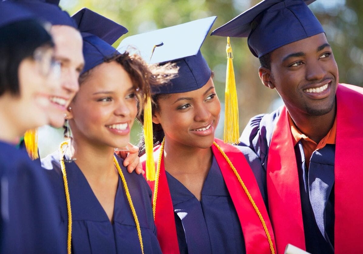 A group of graduates standing next to each other.